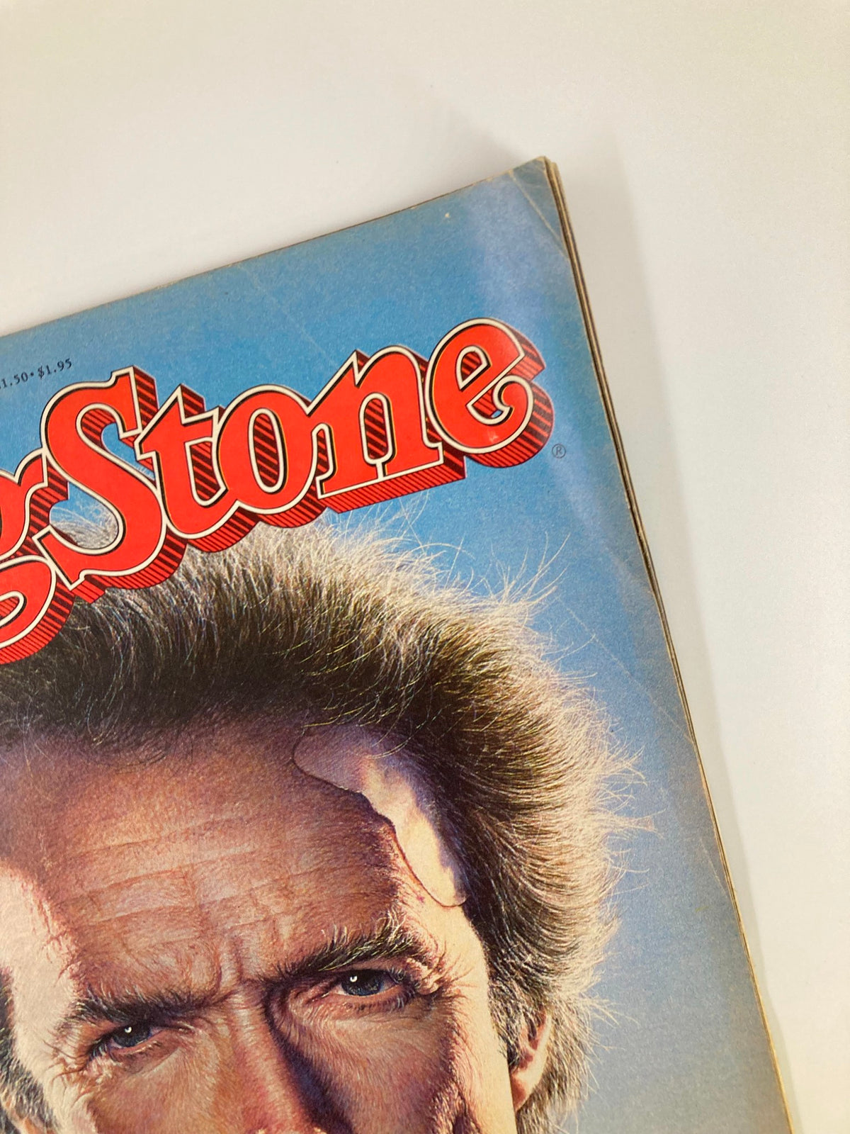 Close-up of the Rolling Stone Magazine title and Clint Eastwood's portrait from the July 4 1985 issue, showcasing iconic 1980s pop culture.