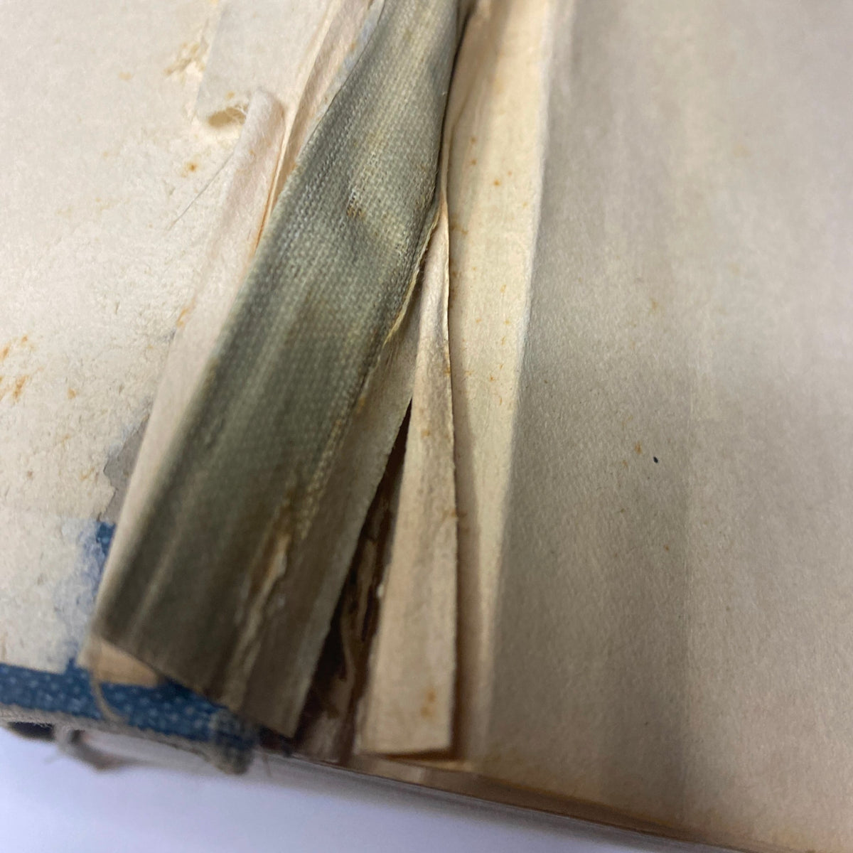 Close-up of the inner binding of 'Time Magazine Bound Weekly January 6, 1930 - June 30, 1930', showcasing the condition of the pages with some wear visible.