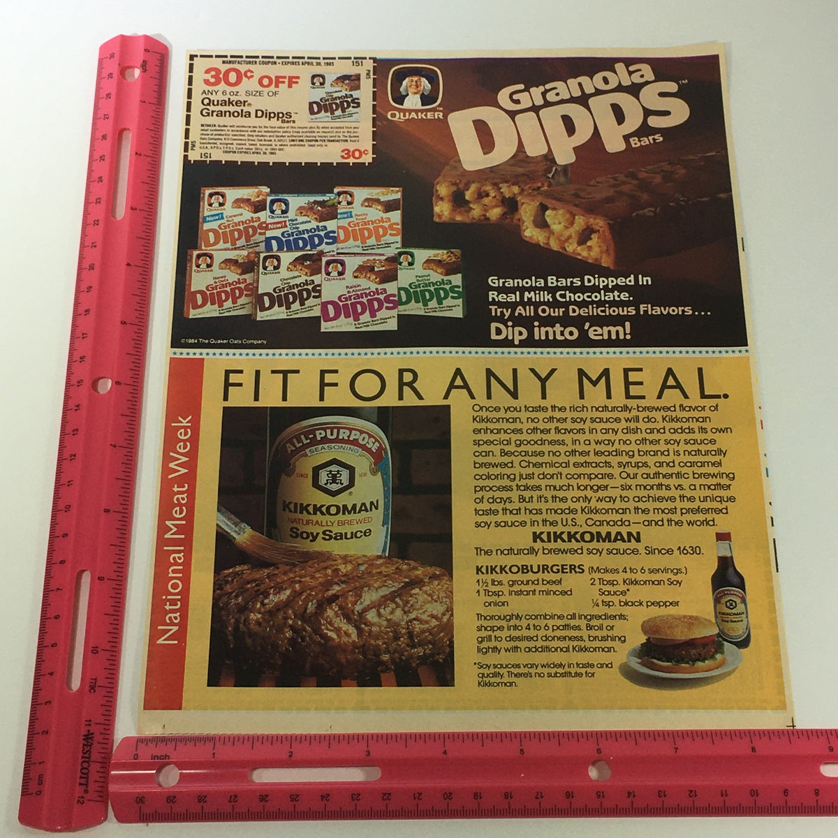 Vintage Quaker Granola Bars Dipps advertisement with a ruler for size reference, showcasing the promotional content for Granola Dipps and Kikkoman Soy Sauce, part of a nutrition-focused print ad.