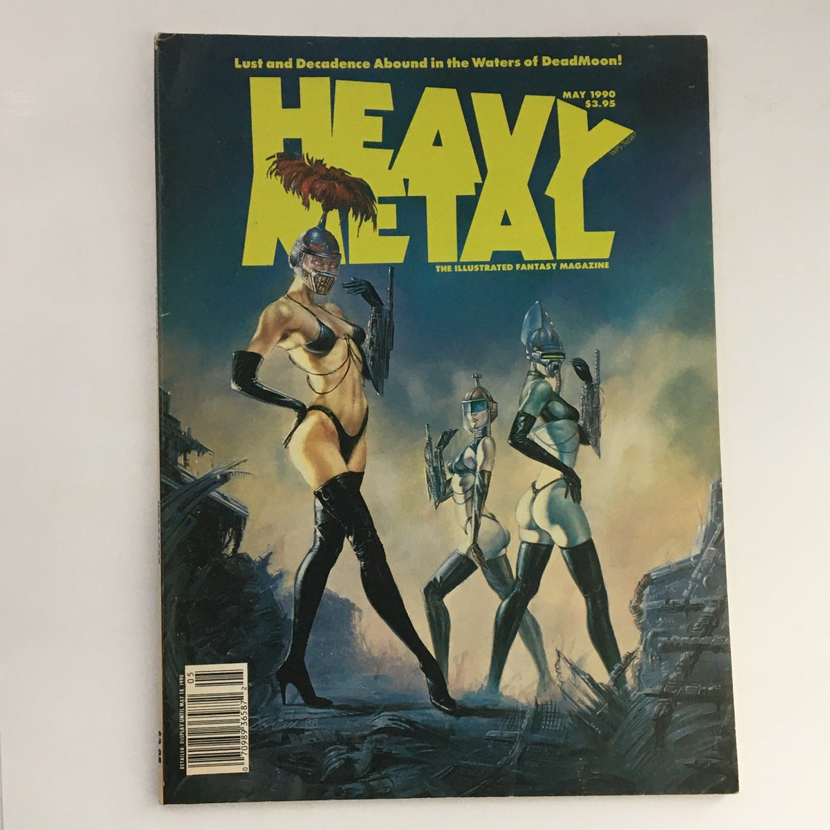 Cover of Heavy Metal Fantasy Magazine May 1990 featuring themes of lust and decadence, showcasing three female figures in provocative outfits against a dramatic sci-fi backdrop.