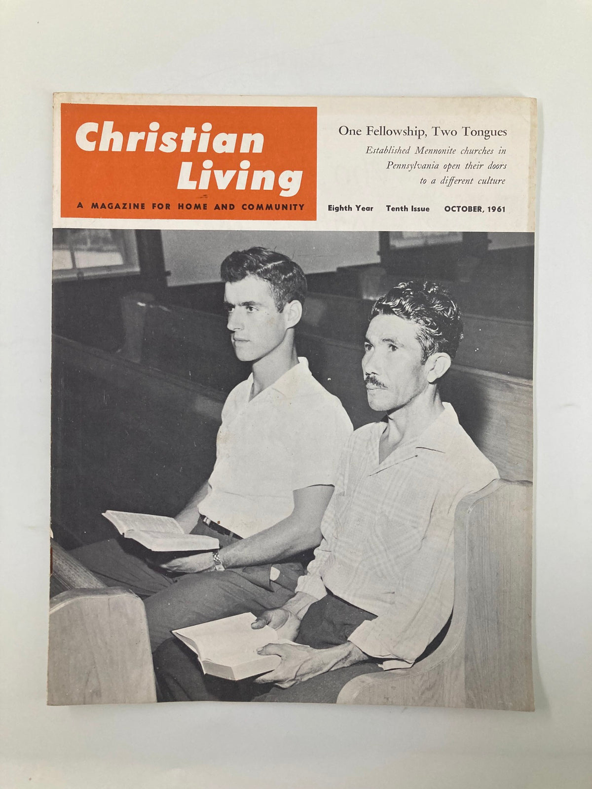 Cover of VTG Christian Living Magazine October 1961 featuring two men sitting in church, holding Bibles, and discussing Christian themes.