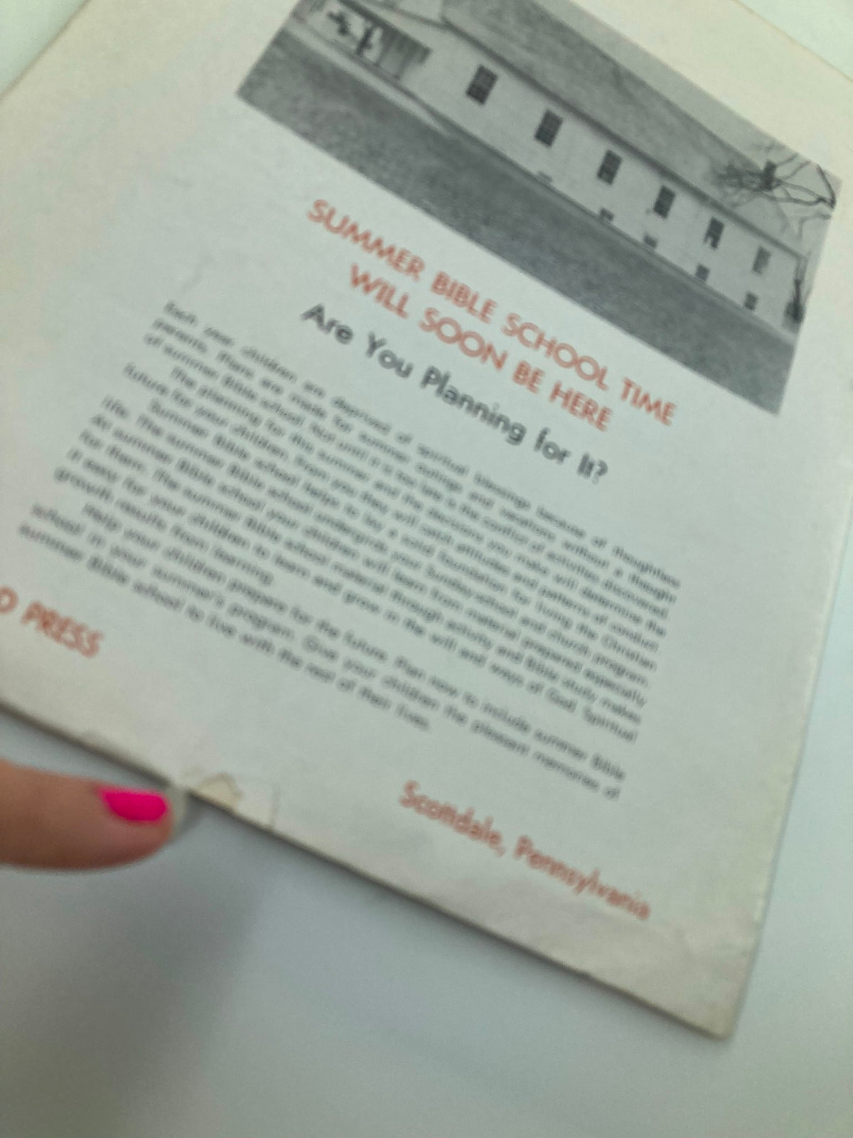 Detailed view of the back cover of VTG Christian Living Magazine March 1960, showcasing text about Summer Bible School planning and an accompanying image of a church building.