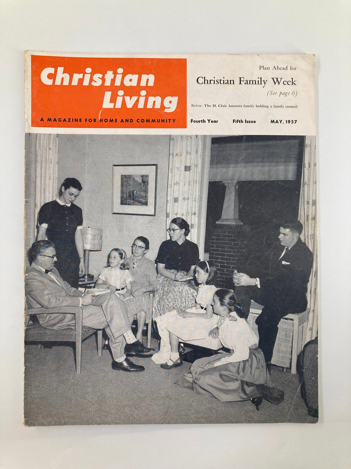 Cover of VTG Christian Living Magazine May 1957 featuring the H. Clair Amstutz Family. The image shows a family gathering in a home setting, reflecting community values and family life from the 1957 issue.
