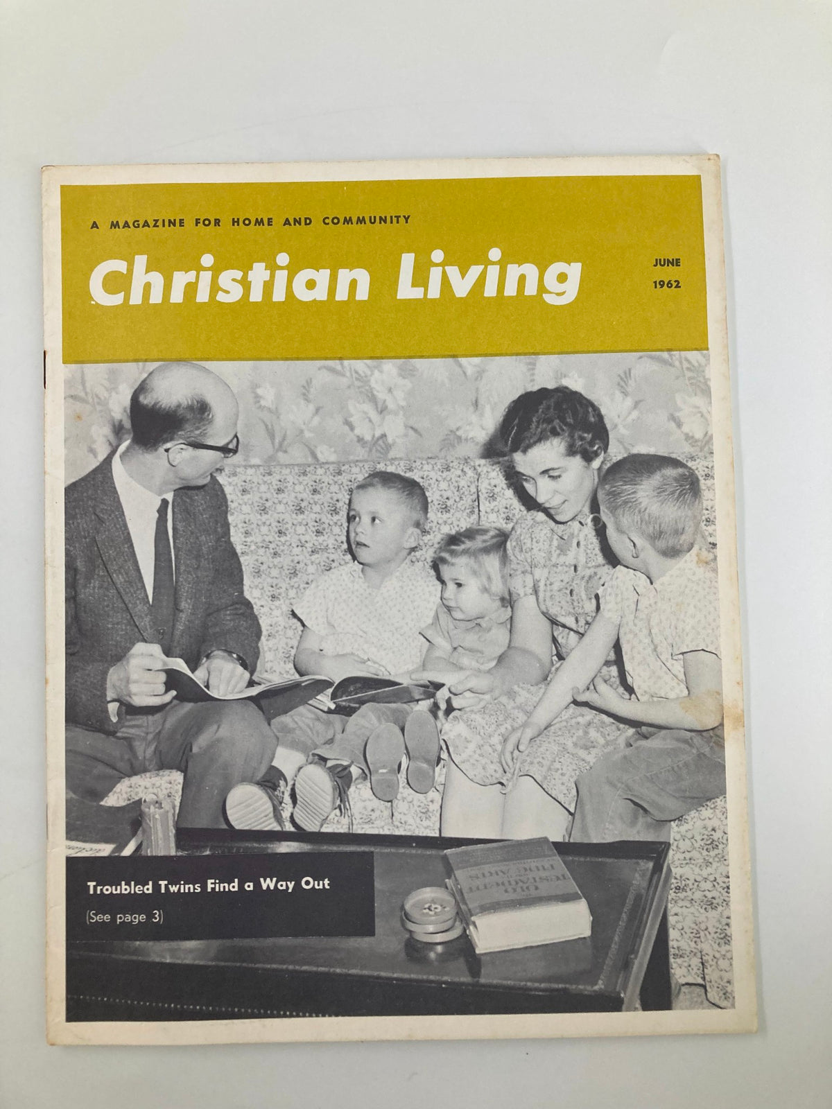 Cover of VTG Christian Living Magazine June 1962 featuring the article 'Troubled Twins Find A Way Out'. Image shows a family sitting together, engaging with children around them. Ideal for collectors of vintage Christian literature.