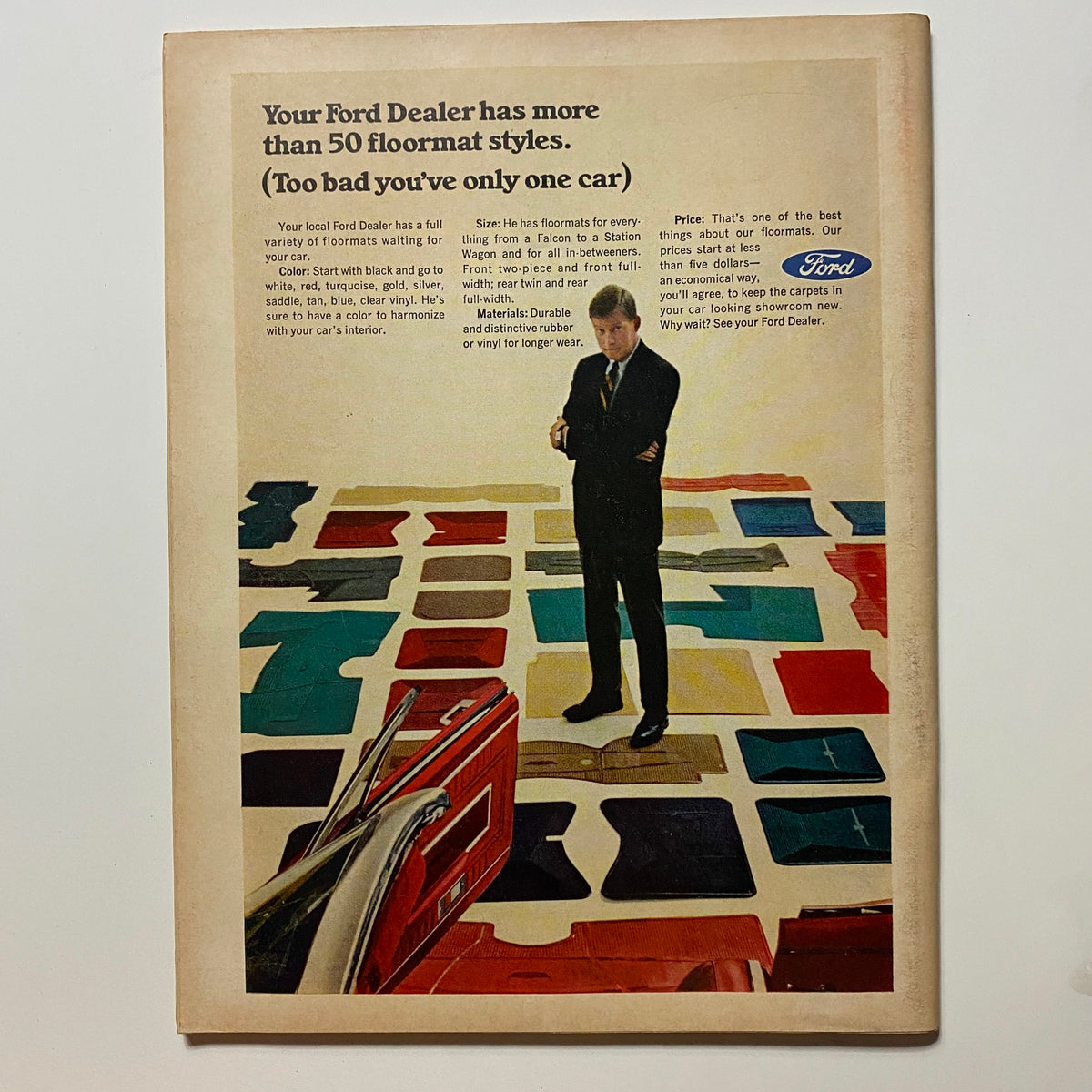 Back cover of VTG Hot Rod Magazine December 1966, featuring a Ford advertisement with a man standing in front of various car floor mat styles.