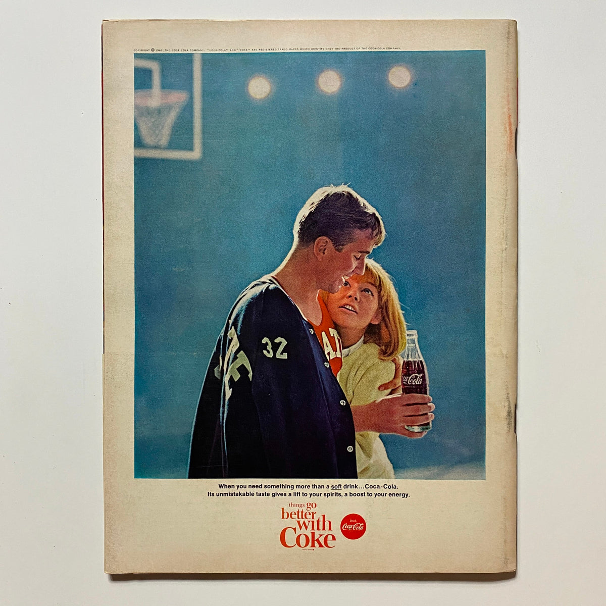 Back cover of VTG Hot Rod Magazine February 1965 featuring a vintage Coca-Cola advertisement with a couple enjoying drinks.