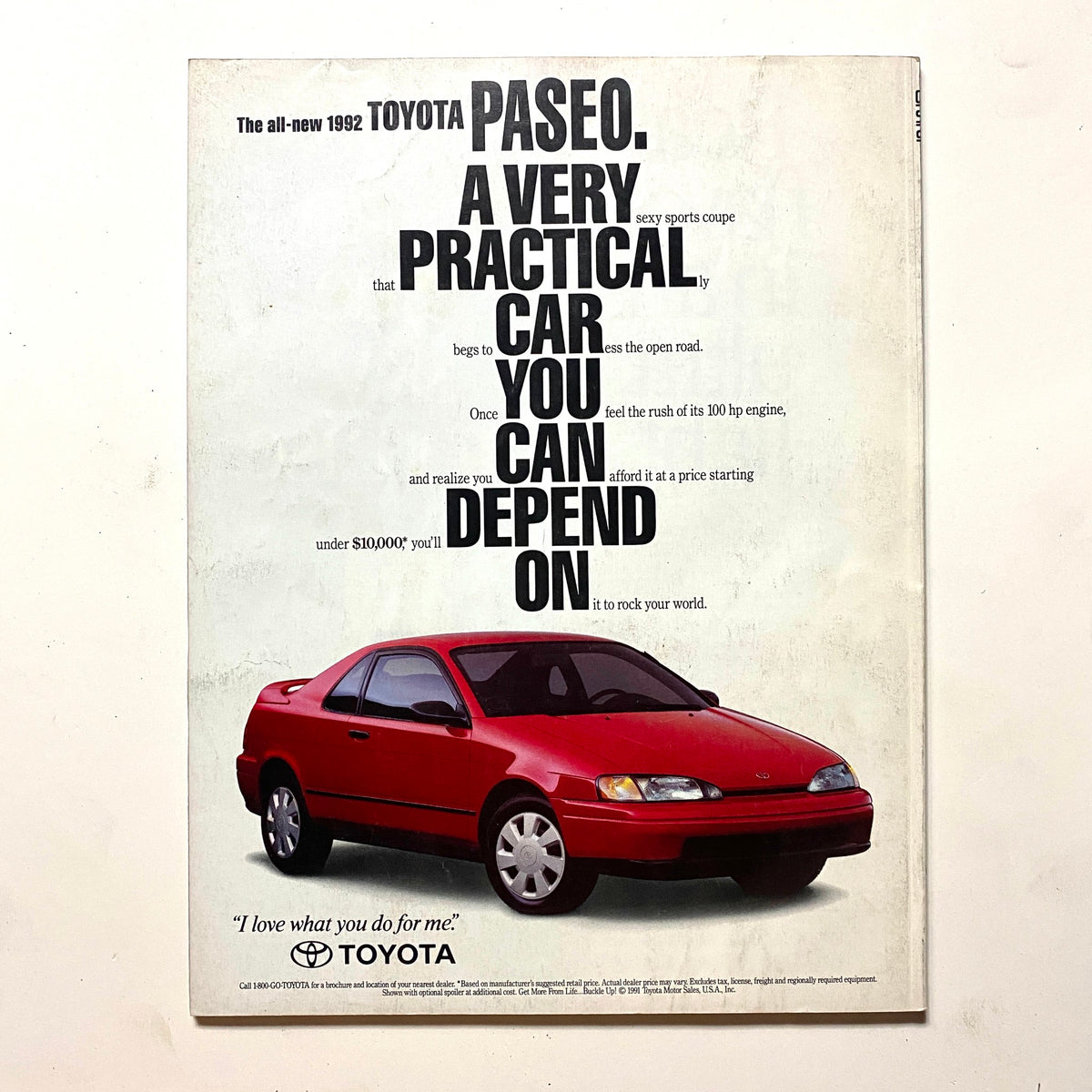 Back cover of Omni Magazine July 1991, Volume 13, Number 10 featuring a vintage advertisement for the 1992 Toyota Paseo, illustrating a sporty red car.