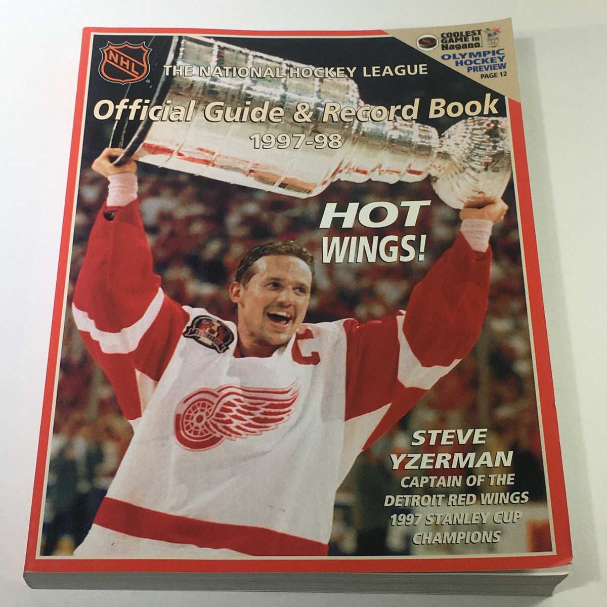 VTG NHL Official Guide & Record Book 1997-1998 featuring Steve Yzerman celebrating with the Stanley Cup for the Detroit Red Wings.