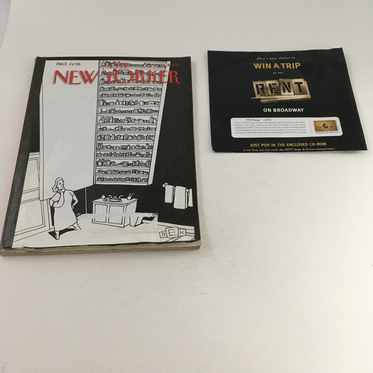 The New Yorker Magazine November 28, 2005 cover featuring the illustration 'Americans at Work' by Bruce Eric Kaplan, alongside a promotional card for the 'Rent' Broadway show.