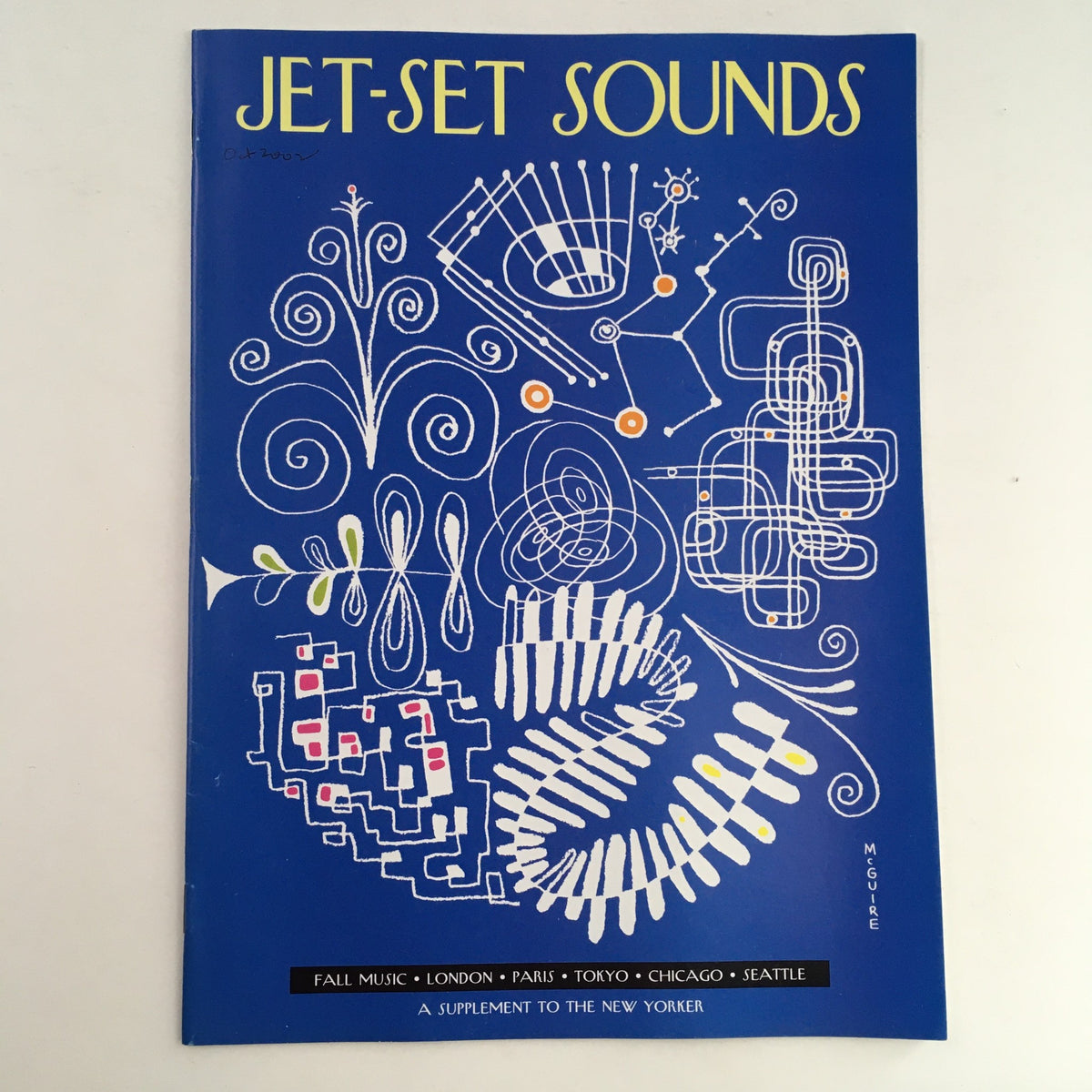 The New Yorker 2002 Jet-Set Sounds Fall Music Theme Cover featuring vibrant abstract designs on a blue background, illustrated by Richard McGuire, showcasing autumn musical themes and urban destinations.