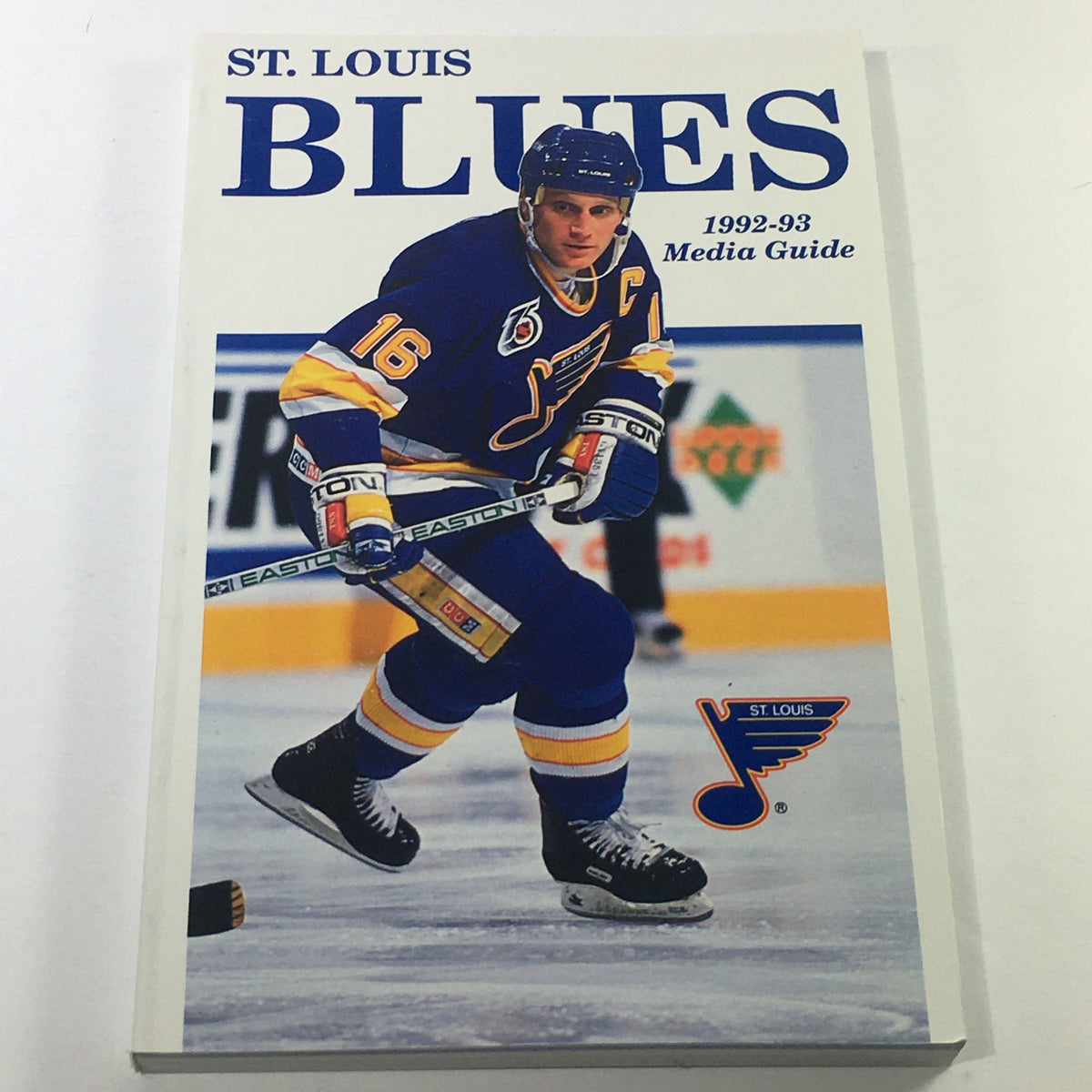 VTG NHL Official Media Guide 1992-1993 - St. Louis Blues featuring player on the cover wearing a blue and yellow jersey with a hockey stick.