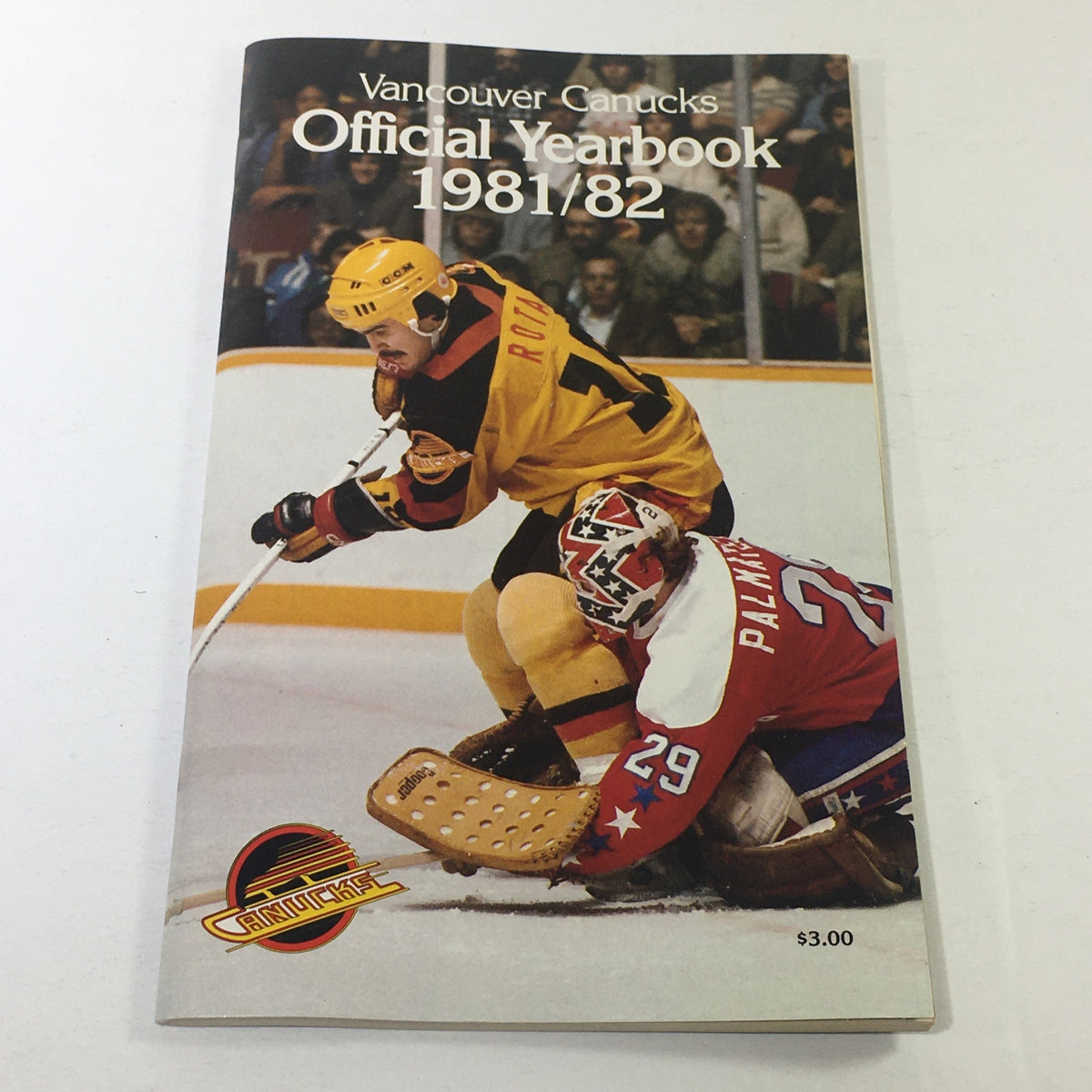 VTG NHL Official Yearbook 1981-1982 - Vancouver Canucks featuring player Darcy Rota on the cover, showcasing vintage hockey history.