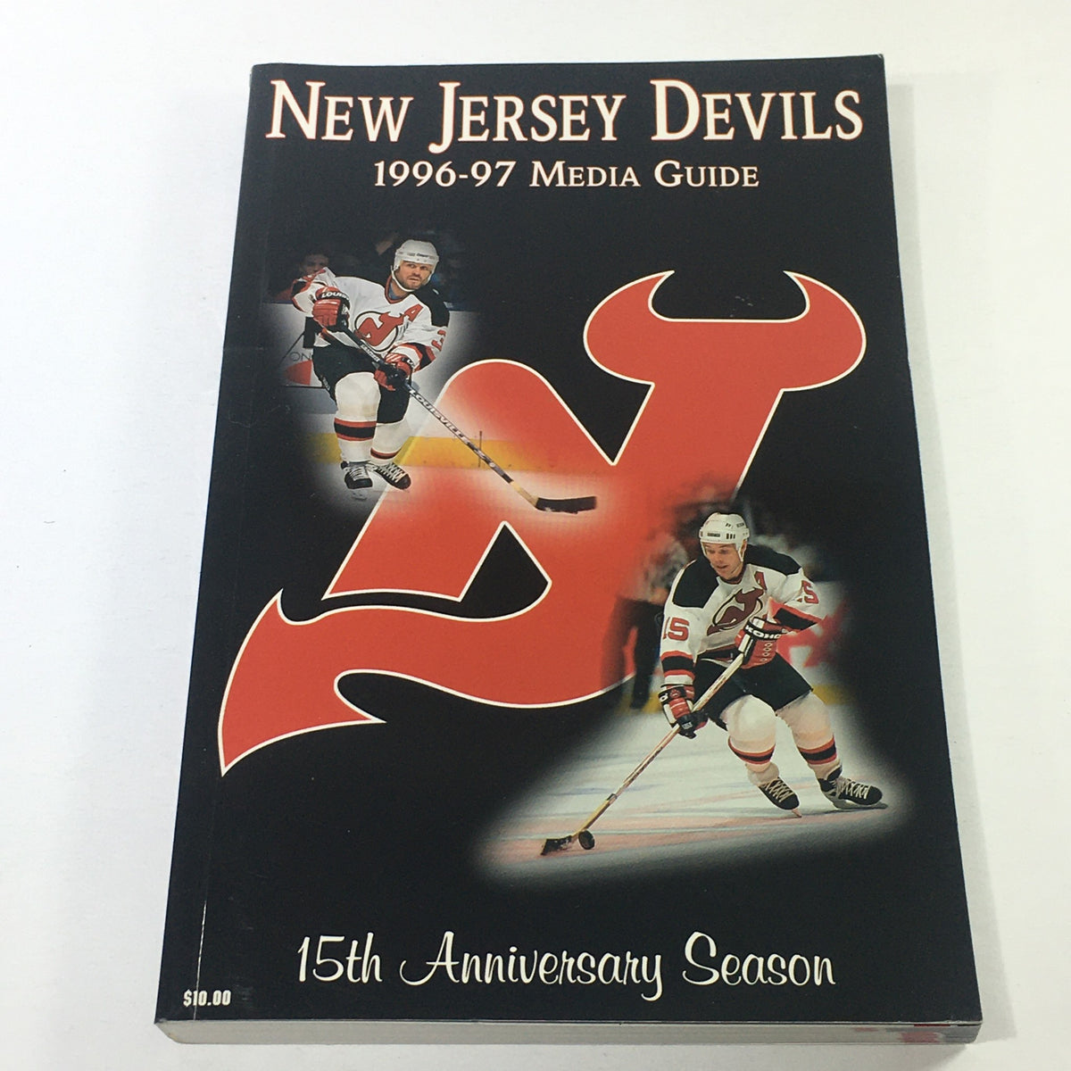 Front cover of the VTG NHL Official Media Guide 1996-1997 featuring the New Jersey Devils logo and player images, celebrating the 15th Anniversary Season.