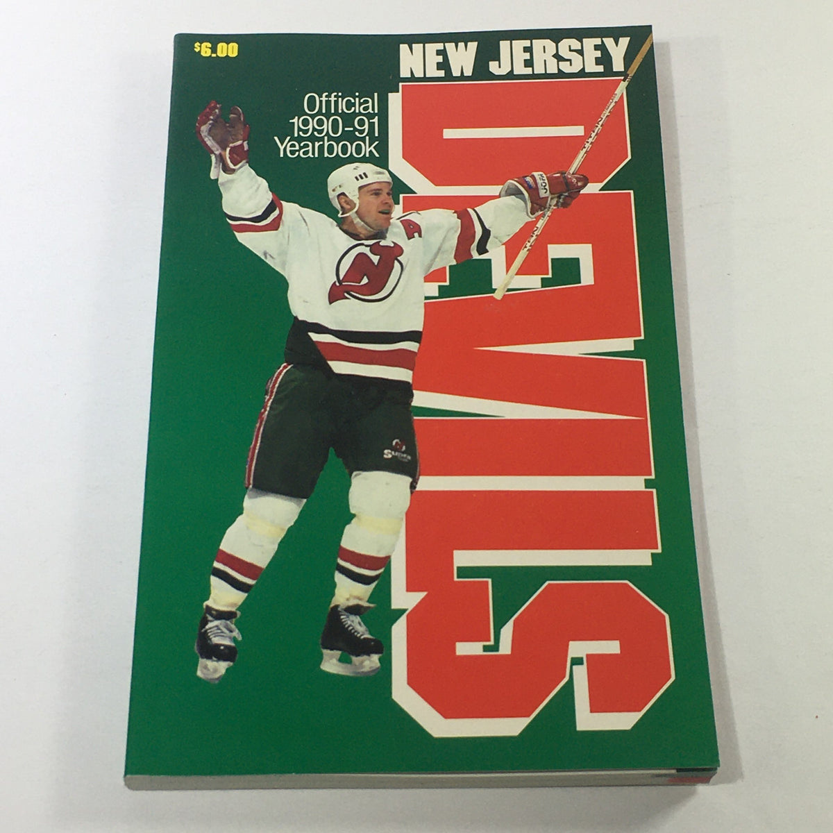 VTG NHL Official Yearbook 1990-1991 featuring the New Jersey Devils player celebrating on the cover.