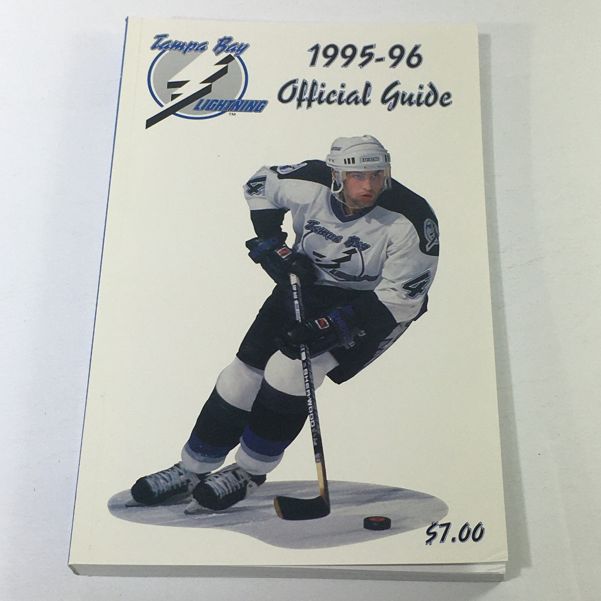 VTG NHL Official Guide 1995-1996 featuring Tampa Bay Lightning's Cory Cross, showcasing the cover design with the player in action.