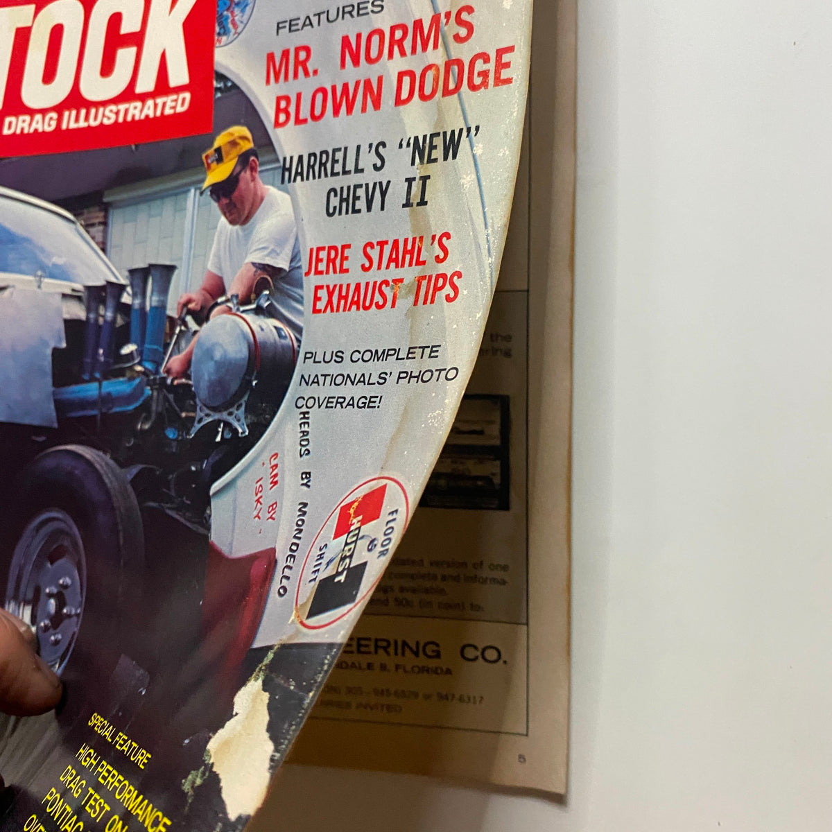Side view of the Super Stock & Drag Illustrated Magazine December 1965 showing details of the cover with features including Mr. Norm's Blown Dodge.
