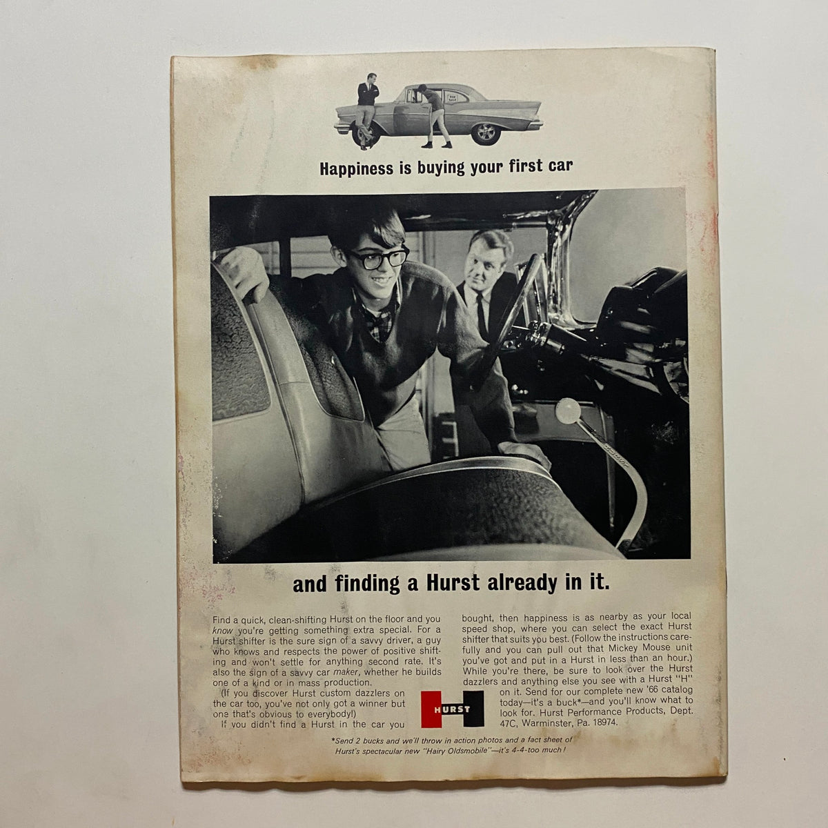 Interior advertisement page from Super Stock & Drag Illustrated Magazine May 1966 featuring the tagline 'Happiness is buying your first car' with a young man and a car's interior, showcasing car culture imagery.