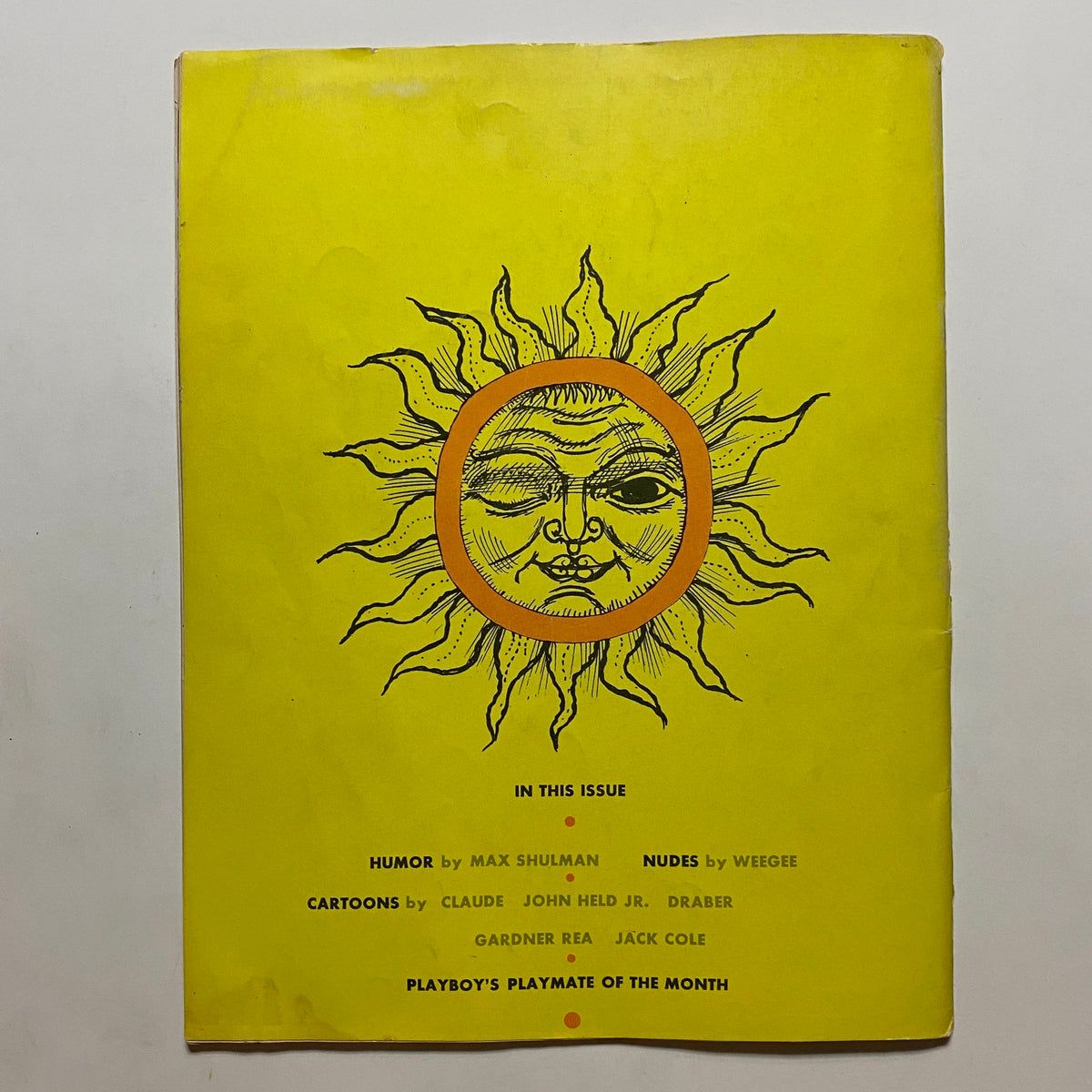 Cover page of VTG Playboy Magazine May 1954 featuring a sun illustration and details about the magazine's content, including humor and nudes, highlighting its collectible nature.