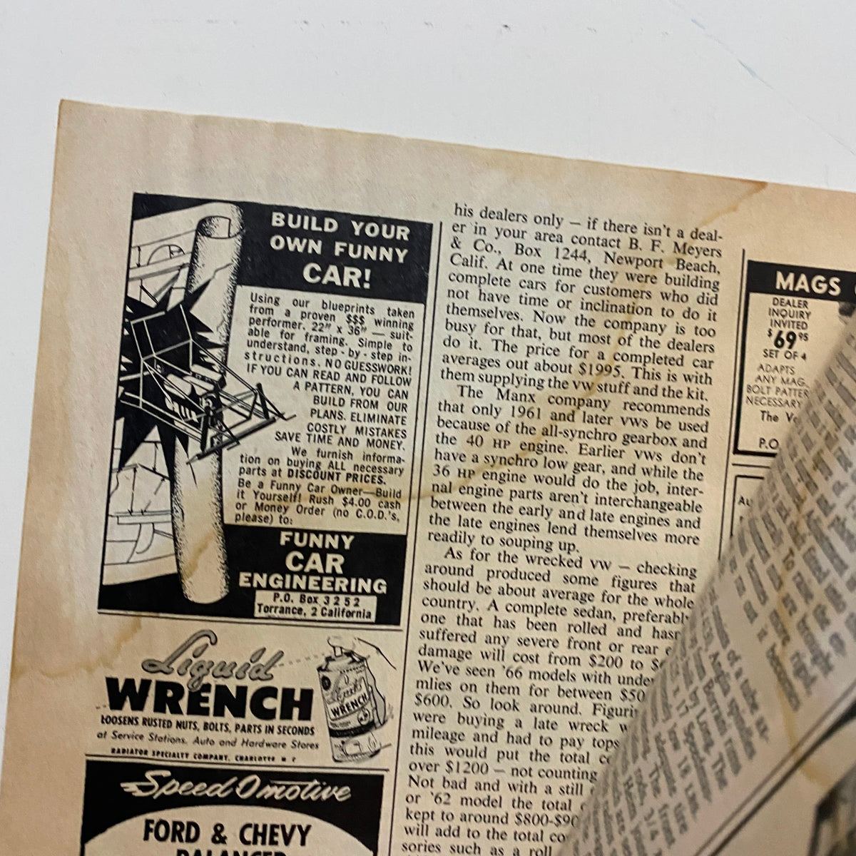 Close-up of an interior page from Vintage Popular Hot Rodding Magazine December 1966, featuring an advertisement related to car engineering and customization, enhancing the vintage automotive experience.