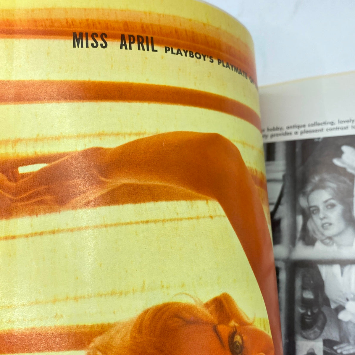 Inside view of VTG Playboy Magazine April 1960 showcasing 'Miss April', Playboy's Playmate, with vibrant colors and artistic photography.