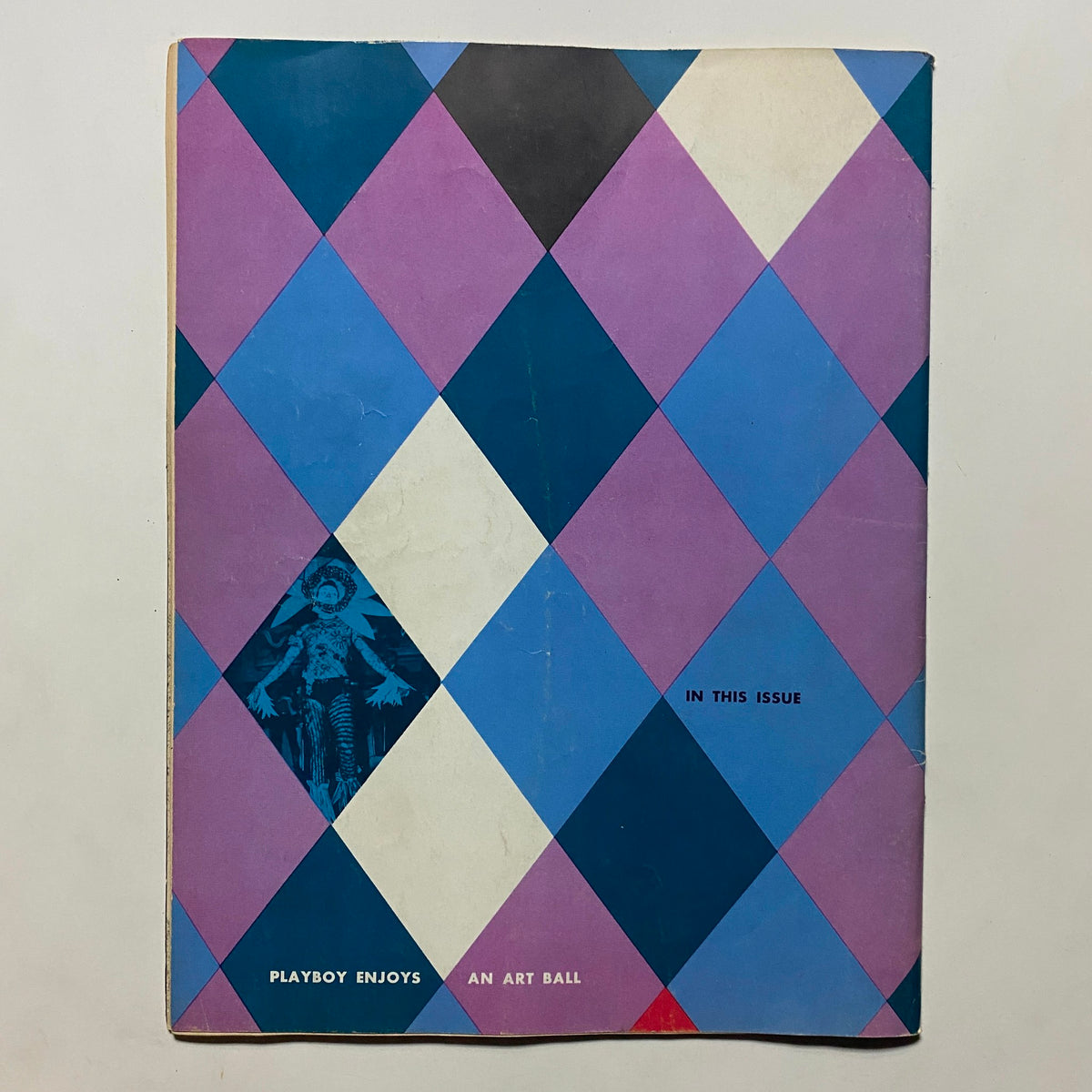 Vintage Playboy Magazine January 1955 showcasing the colorful geometric design cover, highlighting features within the issue.