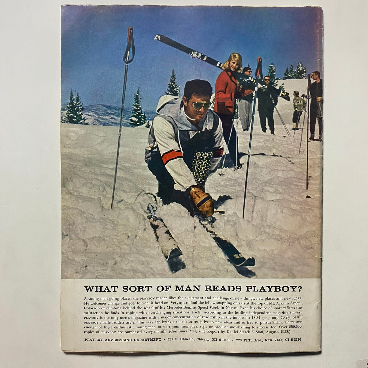 Back cover of VTG Playboy Magazine February 1959, featuring a skiing scene and advertisement reflecting the adventurous lifestyle promoted by Playboy during the era.