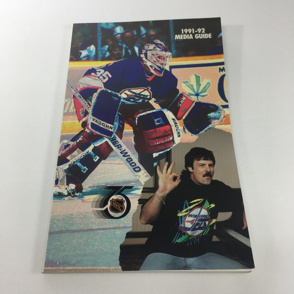 Lot of 6 VTG NHL Official Winnipeg Jets Media Guide & Yearbook 1989 - 1996 featuring the cover of the 1991-92 Media Guide, highlighting the Winnipeg Jets goaltender and a hockey fan with a thumbs up.