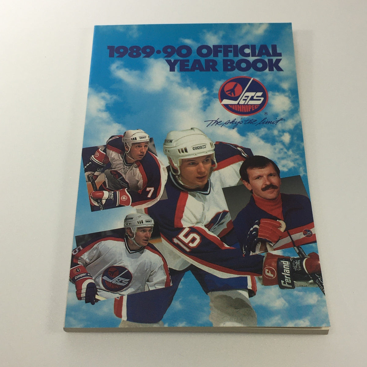Lot of 6 VTG NHL Official Winnipeg Jets Media Guide & Yearbook 1989 - 1996 showing the cover of the 1989-90 Official Year Book, featuring Winnipeg Jets players in action with a blue sky backdrop.