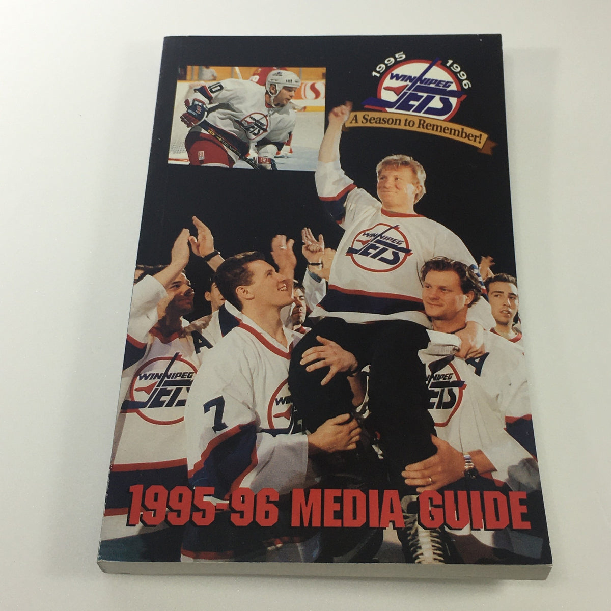 Winnipeg Jets Media Guide 1995-96 showcasing a celebratory team moment, part of the Lot of 6 VTG NHL Official Winnipeg Jets Media Guide & Yearbook 1989 - 1996.