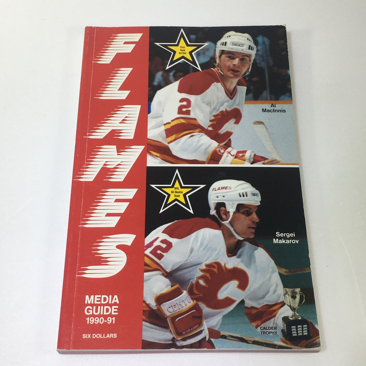 Lot of 7 VTG NHL Official Calgary Flames Media Guide 1990 - 1997 highlighting the 1990-91 media guide with Al MacInnis and Sergei Makarov featured on the cover.
