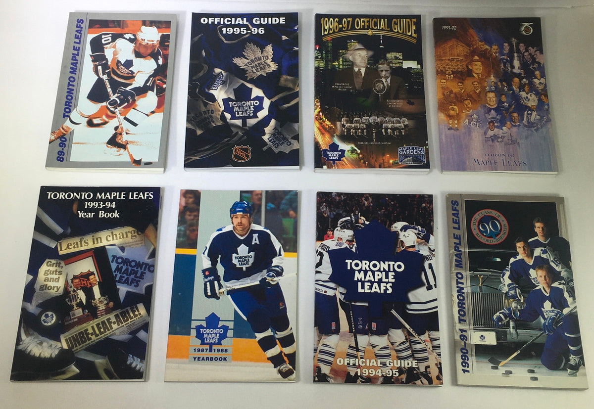 Lot of 8 VTG NHL Official Toronto Maple Leafs Official Guide Yearbook 1987-1997 featuring various covers from Yearbook 1987-88, Fact Book 1989-90, and Official Guides from 1995-97 showcasing the rich history of the Toronto Maple Leafs.