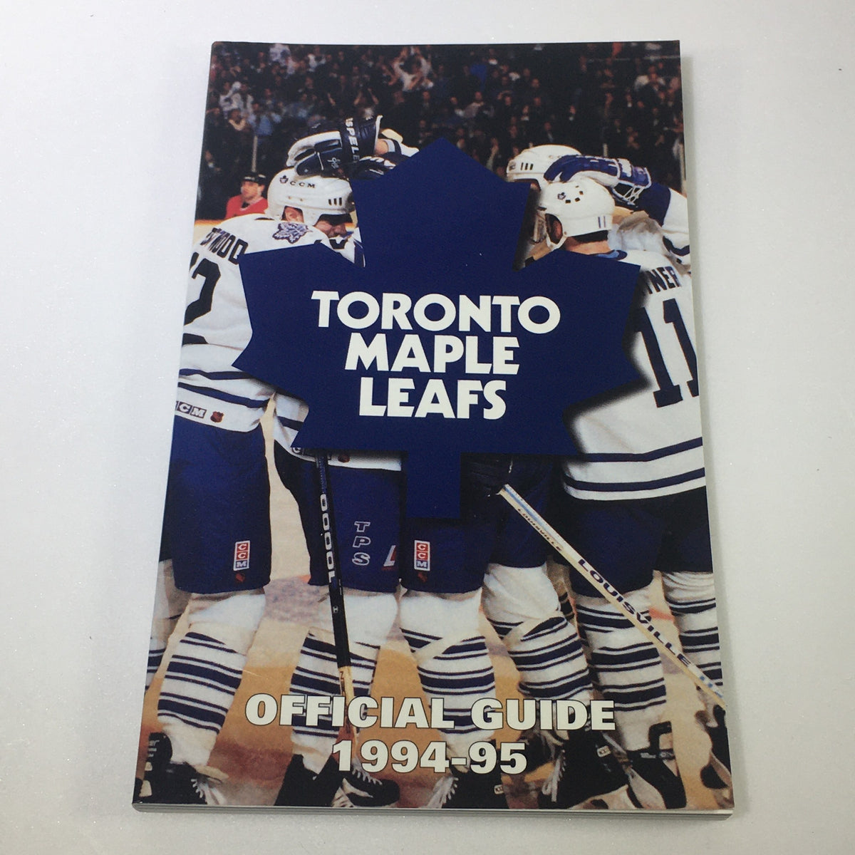 1994-95 Toronto Maple Leafs Official Guide featuring a team celebration photo, part of the Lot of 8 VTG NHL Official Toronto Maple Leafs Official Guide Yearbook 1987-1997 collection.