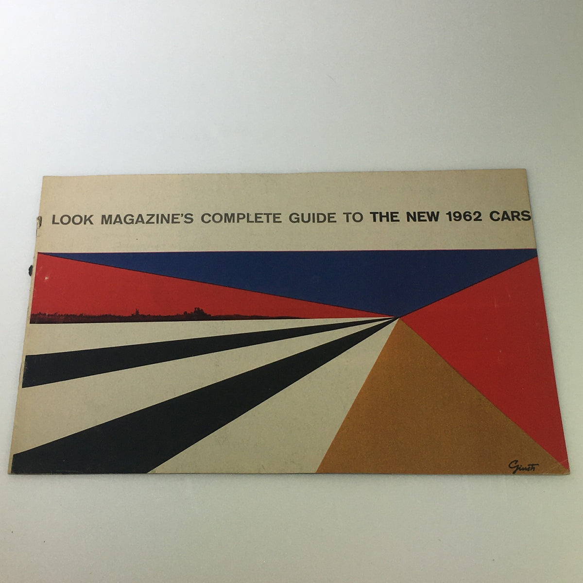 Cover of the VTG 1962 Complete Magazine Guide To New Cars showcasing a vibrant geometric design with the title prominently displayed.