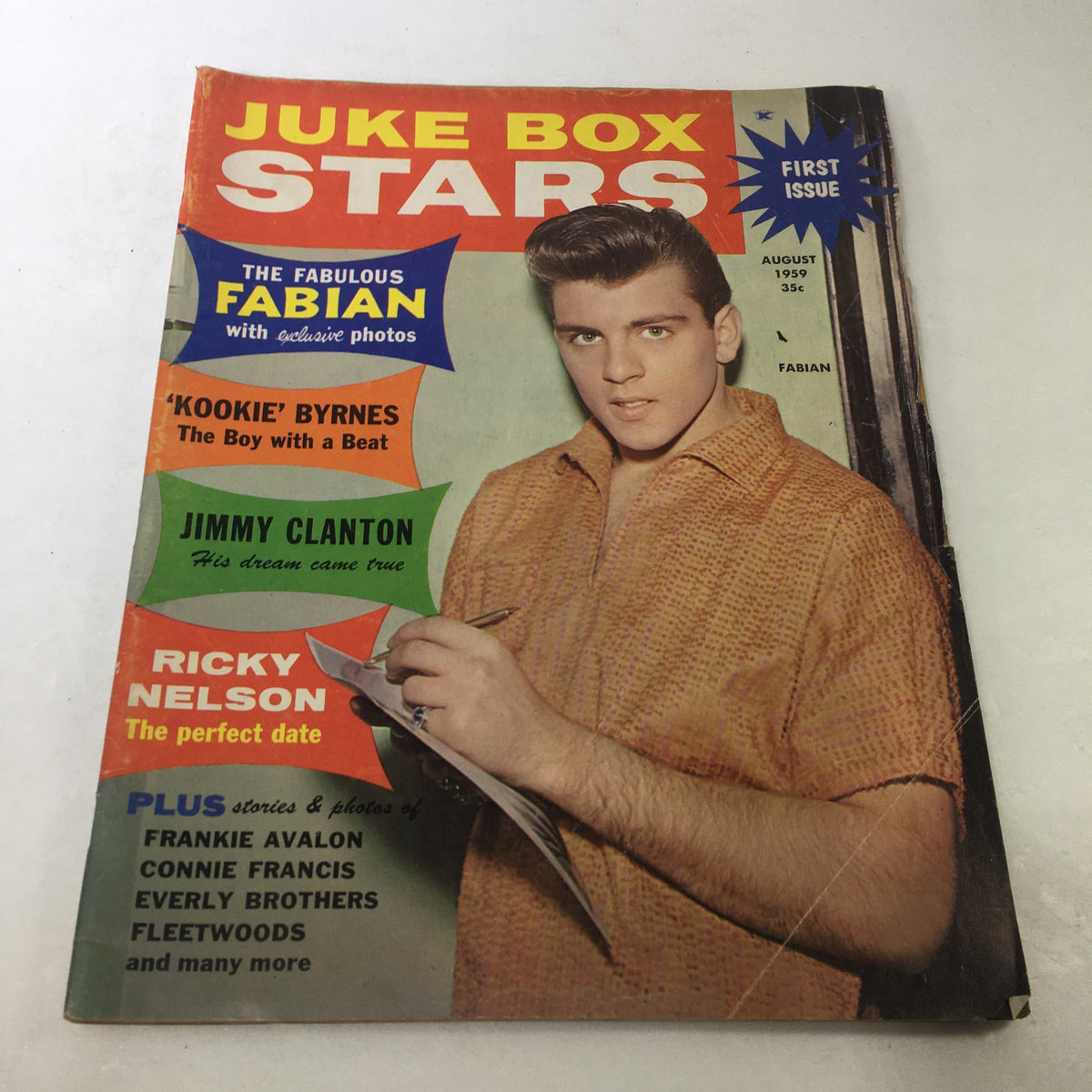 Cover of VTG Juke Box Stars Magazine from August 1959 featuring Fabian, Jimmy Clanton, and Ricky Nelson, showcasing vibrant colors and classic rock and roll themes.