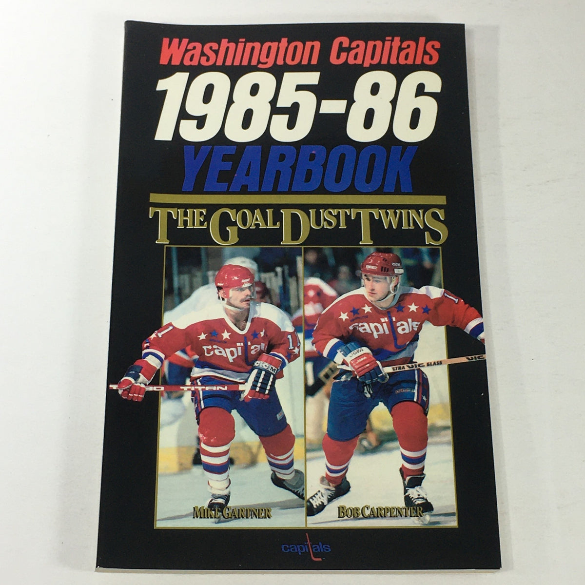 Cover of the VTG NHL Official Yearbook 1985-1986 featuring Washington Capitals and The Goal Dust Twins, showcasing players Mike Gartner and Bob Carpenter.