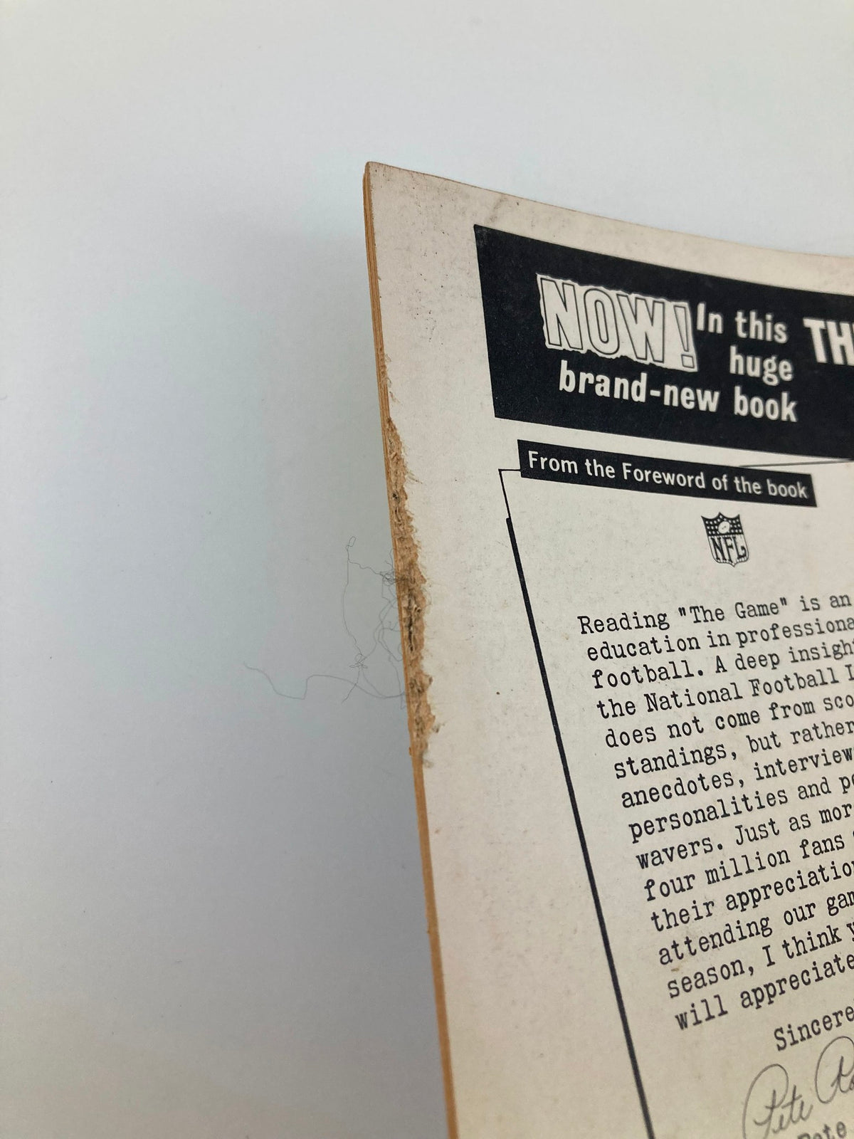 Another side view of the VTG Pro Football 1963 Yearbook, showing edge wear and authenticity of the collectible featuring Yelberton Abraham Tittle.