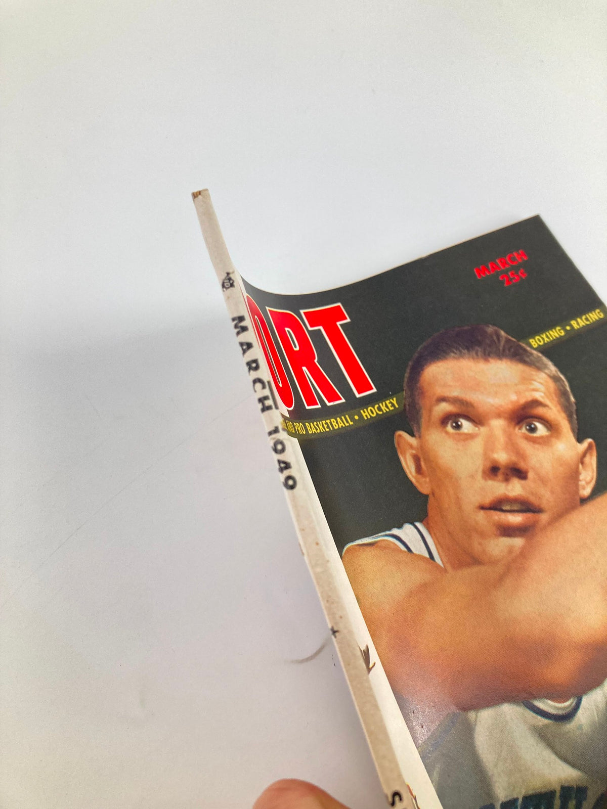 Side view of VTG Sport Magazine from March 1949 highlighting Ralph Beard of Kentucky, displaying magazine details and vintage condition.