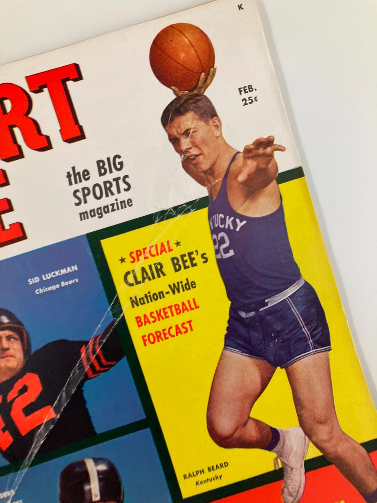 Close-up of Ralph Beard on the front cover of VTG Sport Life Magazine February 1949 with a basketball, showcasing vintage sports memorabilia.