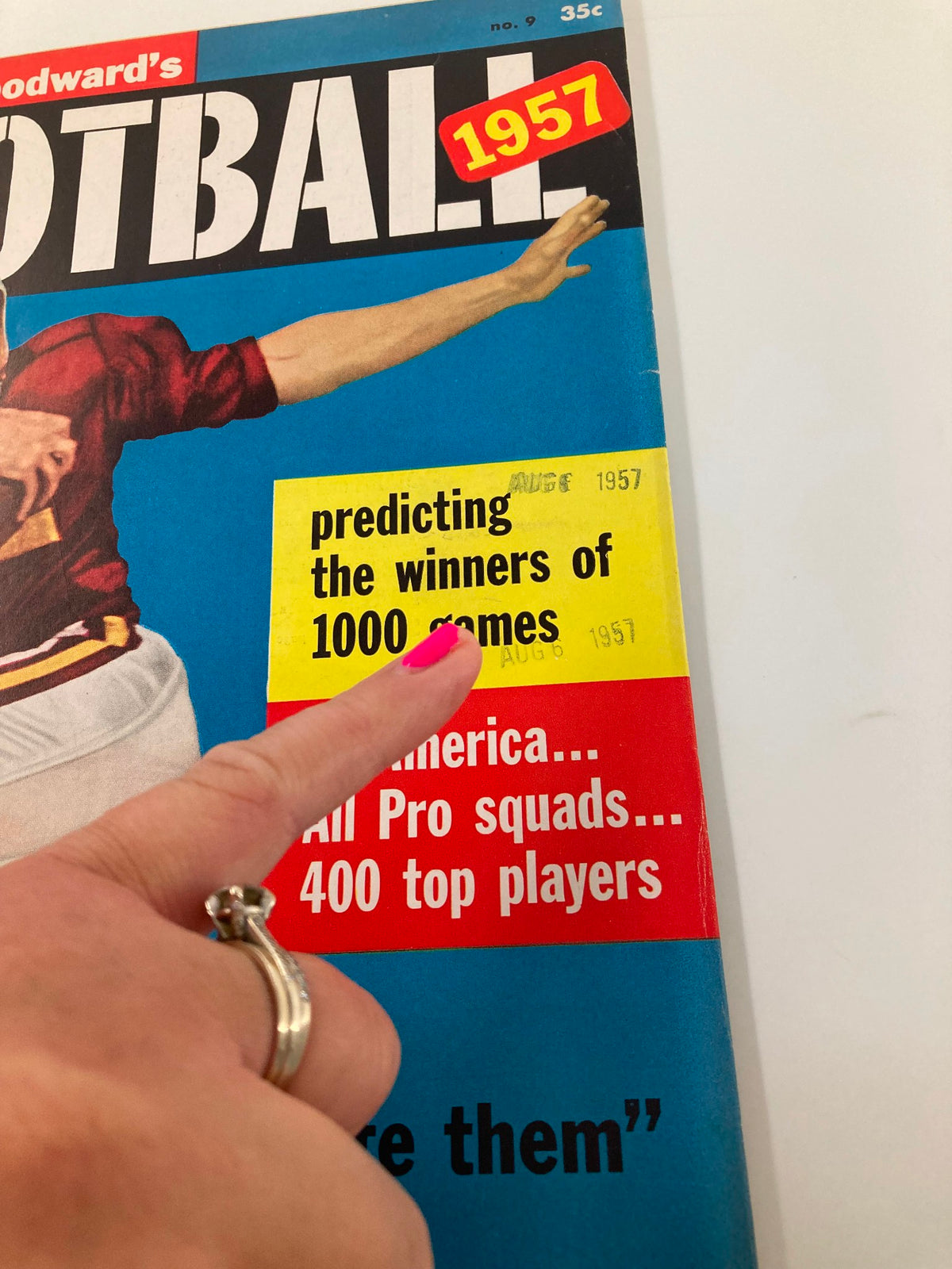 Close-up of Vintage Stanley Woodward's Football magazine from 1957 highlighting the prediction of winners for 1000 games with Bobby Cox on the cover.