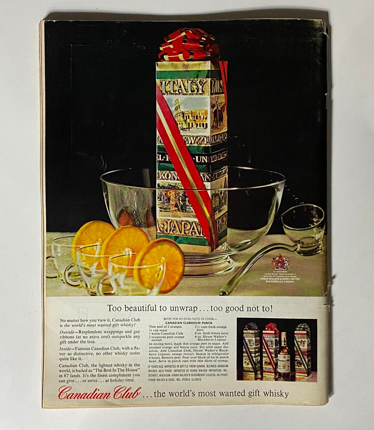 VTG Playboy Magazine January 1962 advertisement for Canadian Club whisky, featuring a festive drink display with garnished glasses and a gift-wrapped whisky bottle.