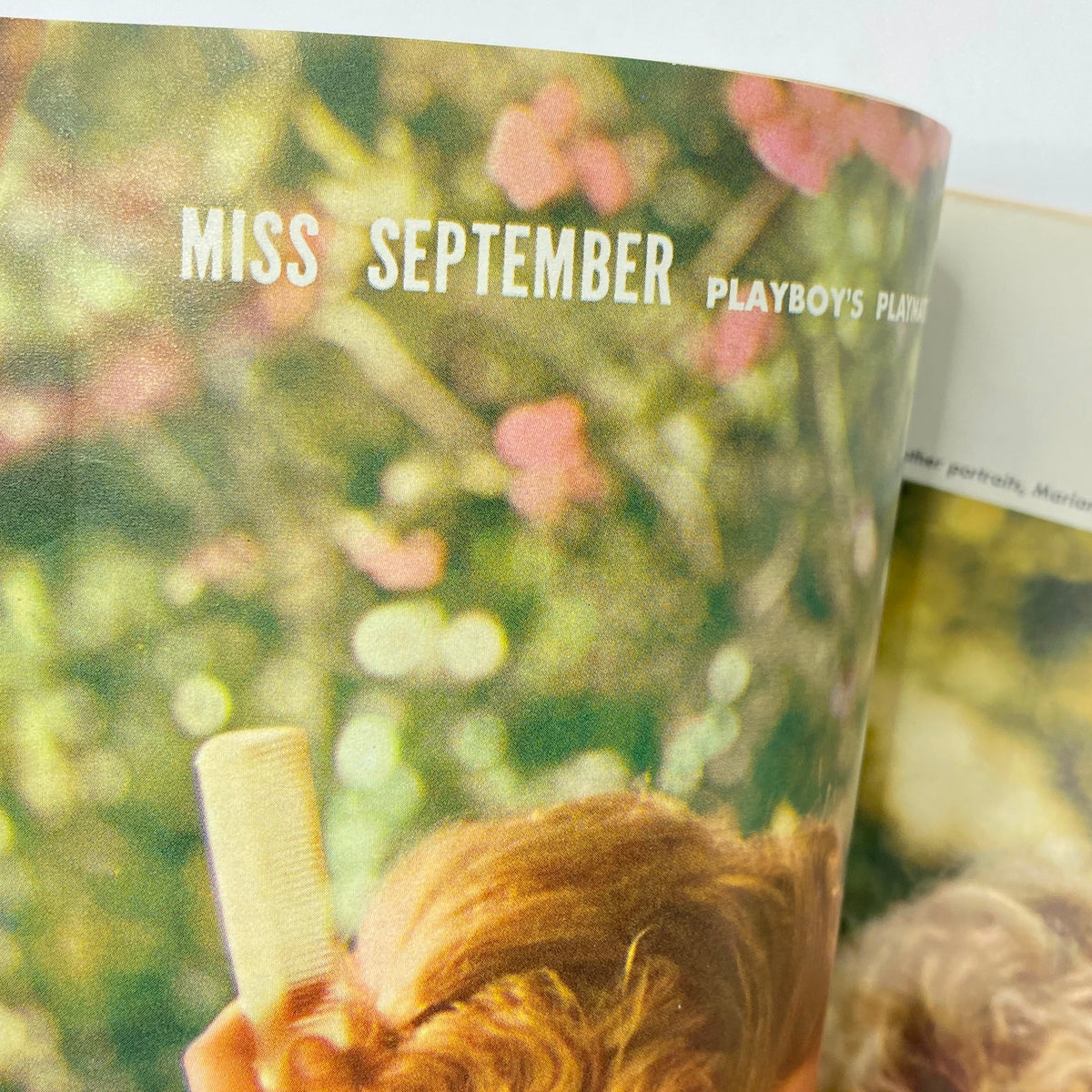 Inside page of VTG Playboy Magazine September 1959, highlighting the feature 'Miss September' alongside vibrant floral background imagery.