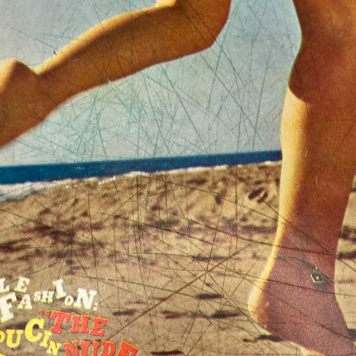 Close-up of VTG Playboy Magazine July 1960 cover focusing on the model's legs and detailed typography.