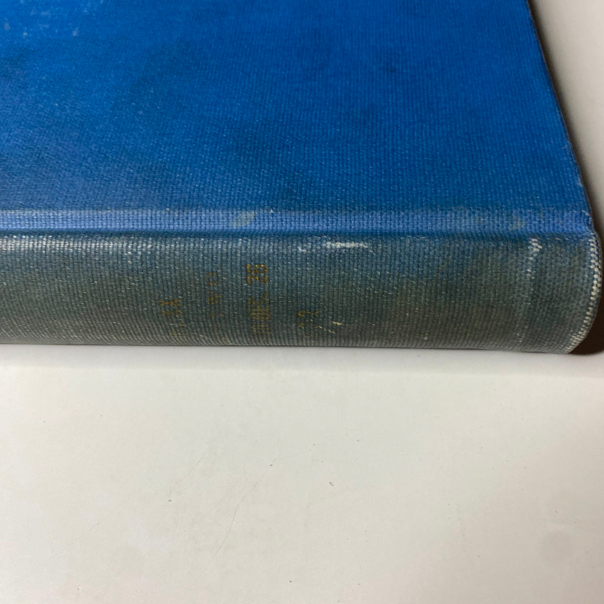 Detailed view of the binding edge of the blue hardcover 'Time Magazine' volume from 1932, emphasizing its vintage character.