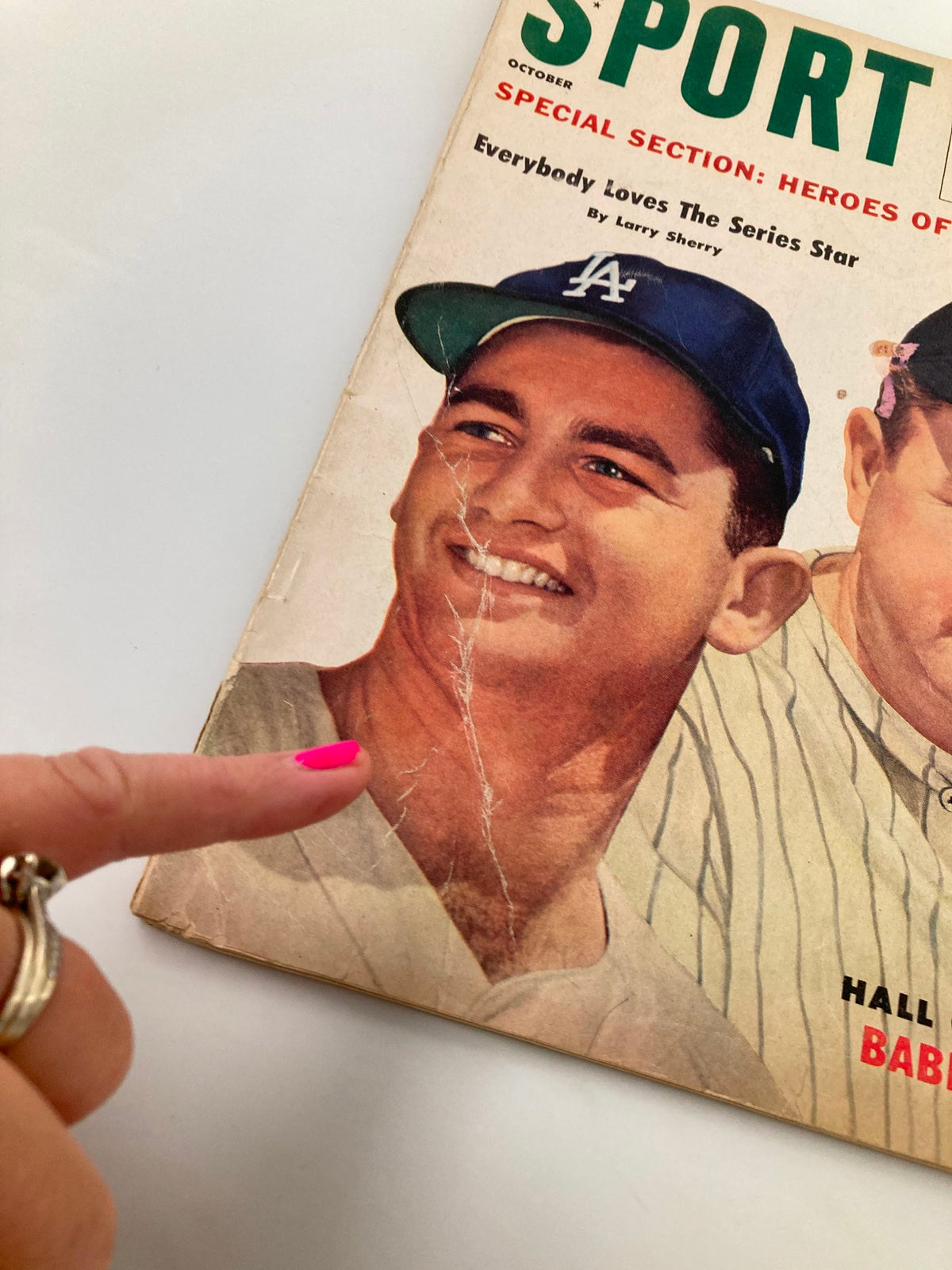 Close-up of the VTG Sport Magazine October 1960 cover, focusing on one player with a visible crease on the magazine.