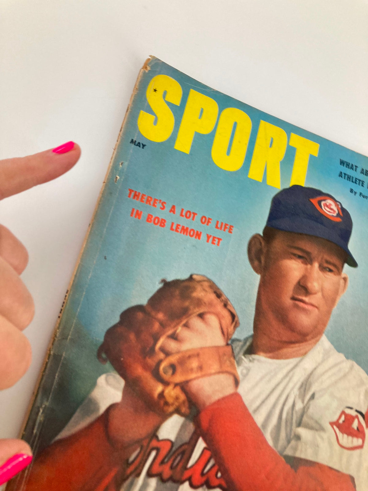 Close-up of the VTG Sport Magazine May 1956 cover featuring Bob Lemon with a gloved hand ready to pitch, highlighting the headline 'There's A Lot of Life in Bob Lemon Yet'.