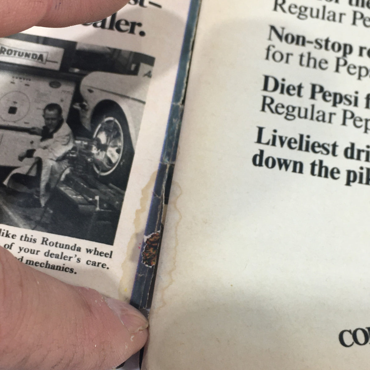 Detailed view of the spine of the Vintage TV Guide from April 30 to May 6, 1966, showing wear and age, relevant for collectors.