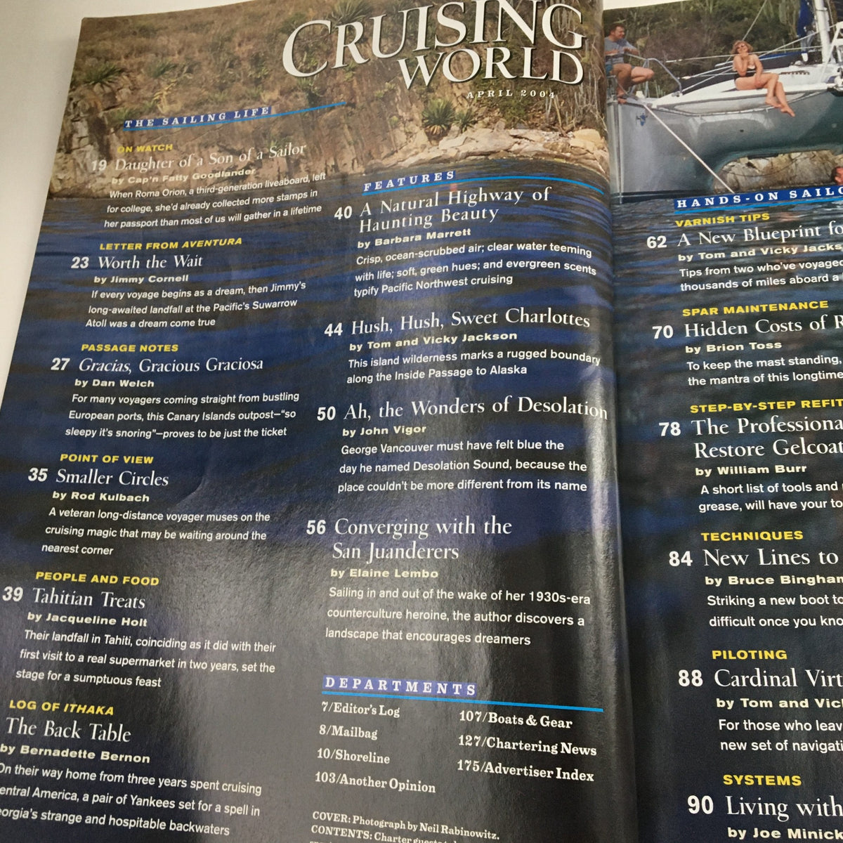 Cruising World Magazine April 2004 cover featuring articles on the Pacific Northwest's enchanted waters, showcasing beautiful sailing imagery and topics like 'Daughter of the Sea' and 'Natural Highway of Haunting Beauty.'