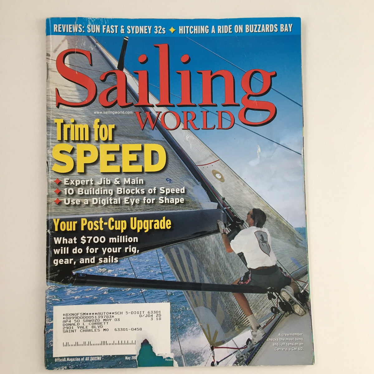 Sailing World Magazine May 2003 cover featuring the title 'Trim for Speed' and 'Your Post-Cup Upgrade'. The magazine showcases expert tips on sailing techniques and performance enhancement, ideal for collectors and sailing enthusiasts.