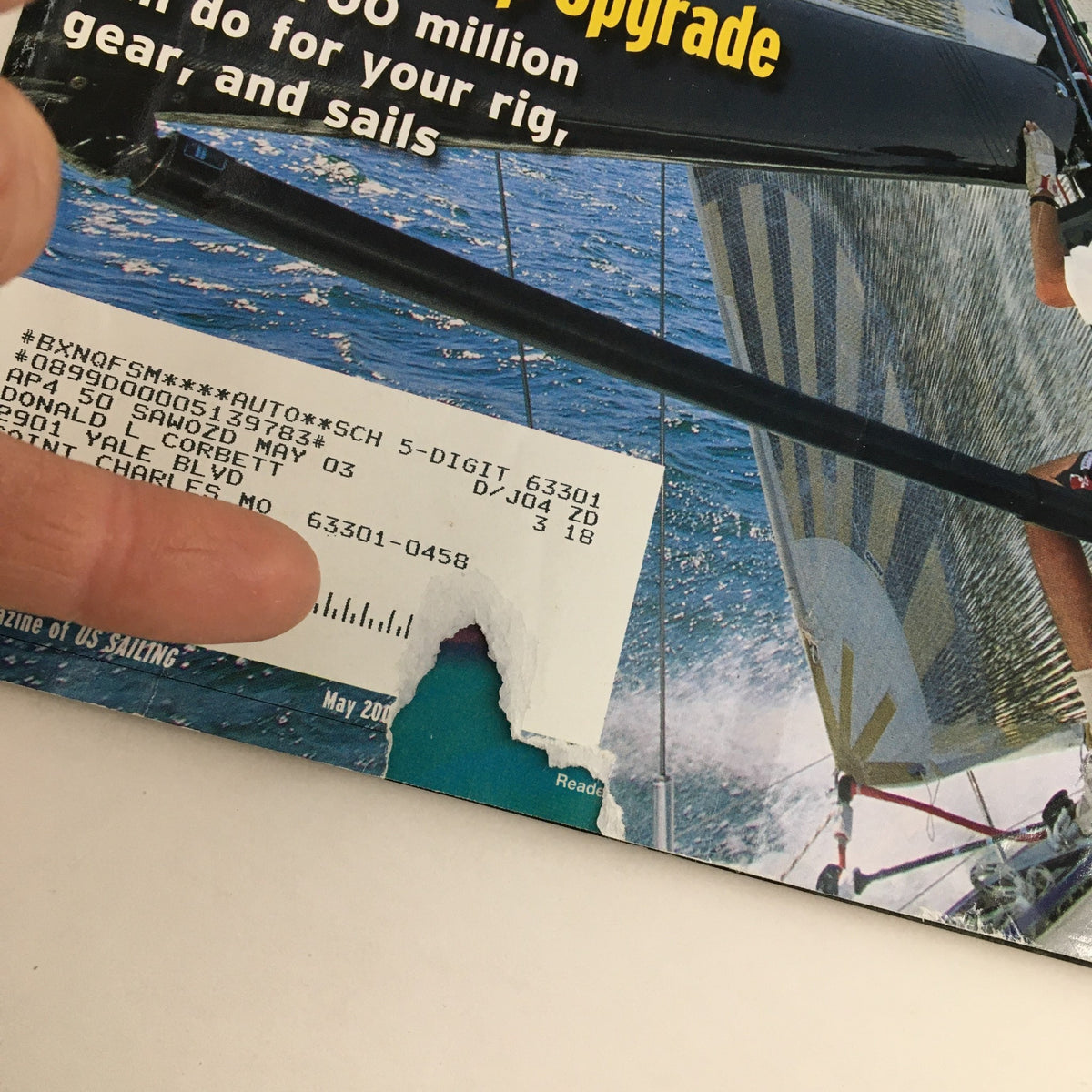 Cover of Sailing World Magazine May 2003, featuring the title 'Trim for Speed & Your Post-Cup Upgrade,' showcasing sailing gear and sails on the water.