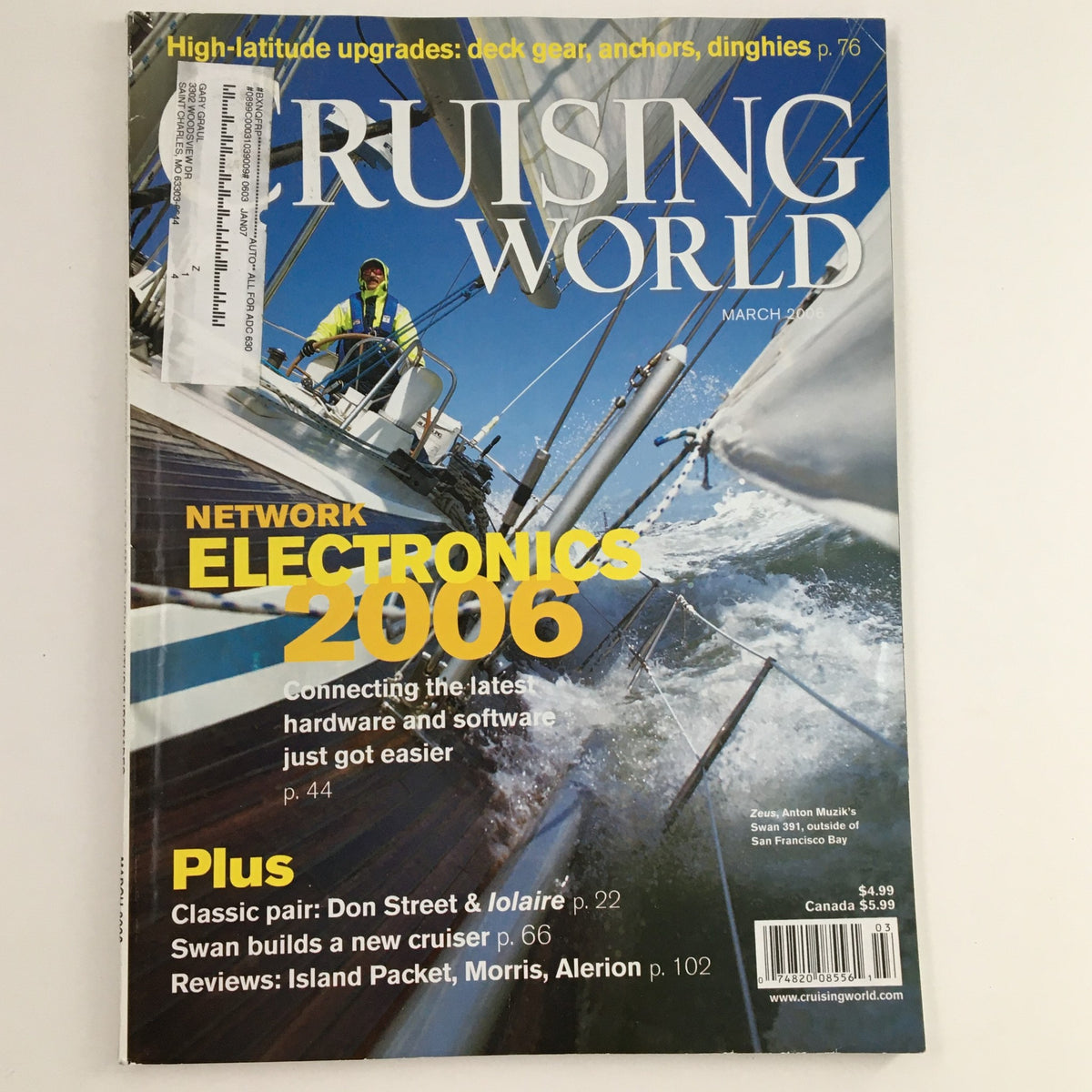 Cover of Cruising World Magazine March 2006 showcasing Network Electronics 2006, featuring a sailboat at sea with a crew member adjusting the sails, and mentioning Don Street and the yacht Iolaire.